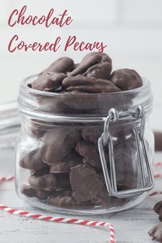 chocolate covered pecans in a glass jar