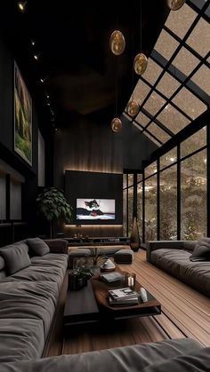 a living room filled with furniture and a flat screen tv mounted to the side of a wall