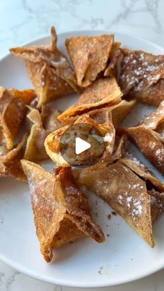 some food is on a white plate with powdered sugar