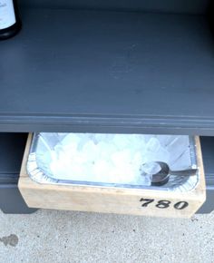 an ice chest with two bottles on it