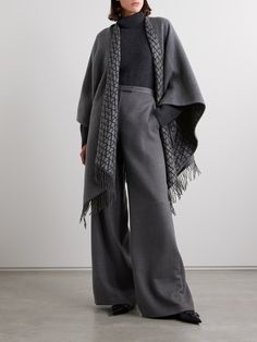 Valentino Garavani's poncho is a chic way to stay warm in transitional weather. Made from sumptuous wool, silk and cashmere-blend, it's jacquard-knitted with the 'VLOGO' at the reverse and has an enveloping design traced with swishy fringing. The deep charcoal shade is endlessly versatile. Leather Sweater, Cape Wrap, Cashmere Poncho, Dress Flats, Grey Scarf, Exclusive Dress, Sports Skirts, Lady Grey, Poncho Cape