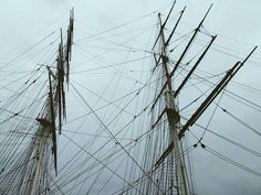 the masts and rigs of an old sailing ship