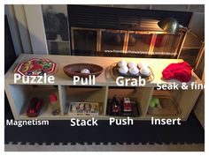 a shelf with some food on top of it next to a fire place in the fireplace