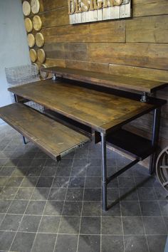 a wooden table with two benches on it in front of a wall that has wood circles