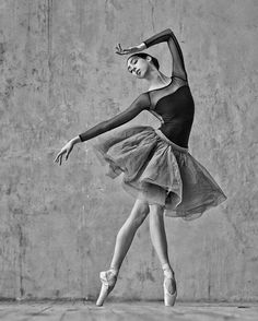 a black and white photo of a ballerina