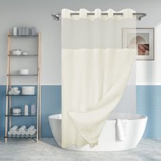 a white bath tub sitting next to a shower curtain