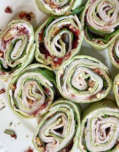 there are many rolls that have been rolled up on the plate and ready to be eaten