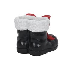 a pair of black and white boots with red bows