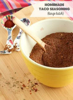 a yellow bowl filled with taco seasoning on top of a wooden table