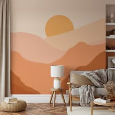 a living room with an orange and pink wall mural on the wall next to a couch