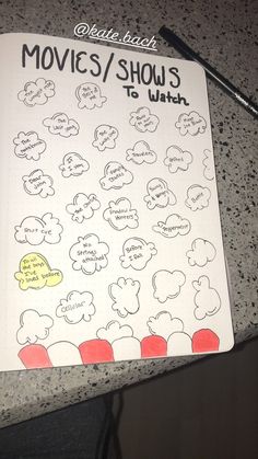 a notebook with the words movies / shows written on it