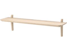 a wooden shelf sitting on top of a white wall