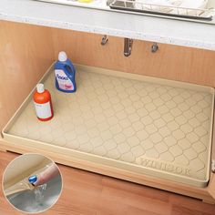 a kitchen sink with cleaning products on the bottom and under it, next to a dishwasher