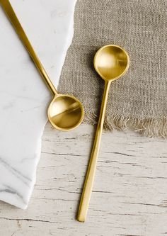 Small brass spoons.