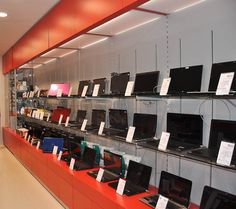 there are many laptops on display in the store