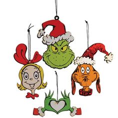 the grinch ornaments are hanging from strings with santa's hats on them,