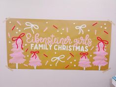 a family christmas sign hanging on the wall