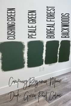 the green paint swatches are all lined up against the white wall in this room