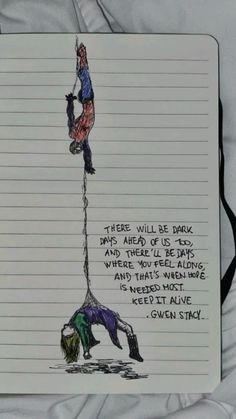 a notepad with a drawing of two people hanging upside down from the top of a pole