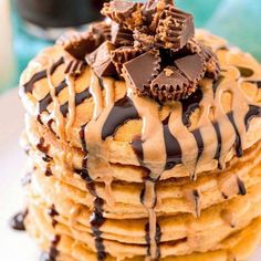 a stack of cookies with chocolate drizzled on top