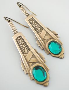 "Art Deco Earrings - Emerald Green Earrings- Vintage Earrings - Brass Earrings - May Birthstone - handmade jewelry So gorgeous! Lovely vintage brass Art Deco earrings embellished with glowing vintage Emerald green glass stone. Fabulous Deco detail. Celebrate the May birthstone. These would make lovely wedding earrings. Chloe says, Wear them and feel fabulous!\" They measure 2 1/4\" long from the top of the ear wire. Thanks for visiting Chloe's Care for your vintage brass jewelry: To brighten you Art Deco Pierced Jewelry For Anniversary, Unique Nickel-free Earrings For Wedding, Art Deco Jewelry As Gift, Antique Nickel-free Dangle Earrings, Antique Jeweled Earrings For Gift, Vintage Style Emerald Drop Earrings, Art Deco Jewelry With Matching Earrings As Gift, Art Deco Jewelry With Matching Earrings For Gifts, Vintage Emerald Earrings For Anniversary