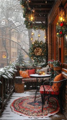 a porch covered in snow and decorated for christmas