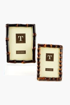 two framed pictures with the letter t on them are sitting next to each other in front of a white background