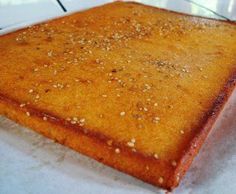 a square piece of bread with sesame seeds on it sitting on top of a counter