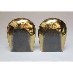 pair of gold and silver vases on white background