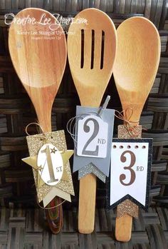 wooden utensils with numbers and tags on them