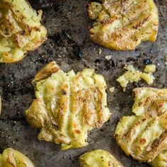 several pieces of food on a baking sheet