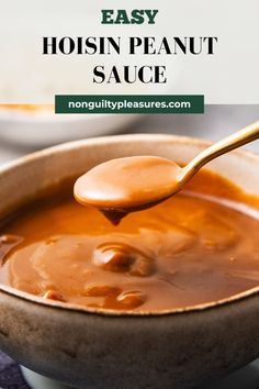 a spoon full of peanut sauce in a bowl with the words easy hoisin peanut sauce