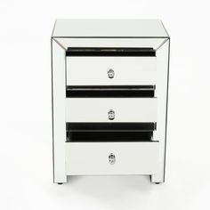 a white mirrored three drawer night stand with chrome trimmings and black drawers on each side