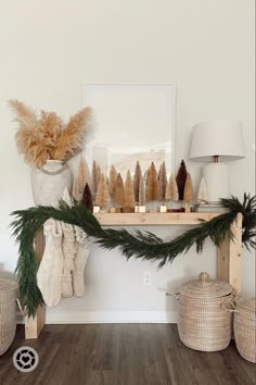 a christmas mantle with pine cones and stockings on it