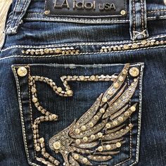 Nwot. L A Idol Usa Bootcut Jean Embellished With Studded Sparkle And Elaborate Stitching. Bootcut Is The Universally Flattering Cut. Intentional Distressing. Five Pocket. Size: 7 Measurements: Waist 30”, Length 34”, Rise 8” Never Worn. Bling-Bling Rhinestone Bootcut Jeans Outfit, Y2k Jeans With Gems, Jeans With Gems On Pockets, Jeans With Jewels On Back Pockets, Bootcut Rhinestone Jeans, Bling Bootcut Jeans, La Idol Jeans, Early 2000s Outfits, Country Jeans