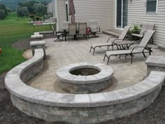 a fire pit in the middle of a patio