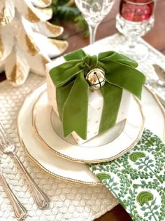 a table set with place settings, napkins and silverware