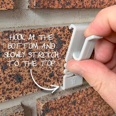 The easiest way to hang stuff on brick Please measure your brick before you buy Designed for brick 2 1/4 inches tall with mortar recessed at least ¼ inch Securely hang items on brick walls, indoors and out Quick and easy to use: hook the hanger on the bottom of the brick and slowly stretch it to hook the top of the brick Reusable; No tools needed; Will not damage your bricks Hanging Things On Brick Walls, How To Hang Things On Brick, Outside Brick Wall Decor Ideas, Decorating A Brick Wall, Outdoor Brick Wall Decor Ideas, Brick Wall Decor Ideas, Brick Hooks, Brick Hanger, Building A Brick Wall