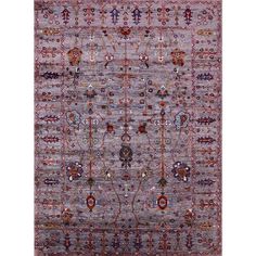 an area rug with various colors and designs on the front, along with a white background