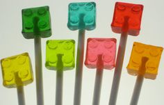 four lego lollipops with different colors on them