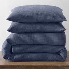 three pillows stacked on top of each other