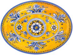 a yellow and blue bowl with flowers on it's rim, in the shape of a flower