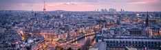 an aerial view of the city at dusk