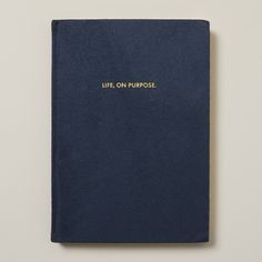 a blue book with the words life on purpose written in gold