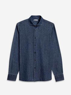 Upgrade your fall wardrobe with our arthur denim shirt. made from lightweight indigo cotton this go-to button-up offers a fresh casual vibe with its spread collar and black buttons. perfect for any outfit this shirt is a stylish and versatile addition to your closet.    - denim twill fabric  - light weight  - textured  - spread collar  - clean minimal look  - 100% cotton Chambray Button-up Shirt With Buttons, Chambray Button-up Shirt, Classic Denim Blue Shirt With Snap Buttons, Classic Denim Shirt With Snap Buttons, Classic Chambray Top With Buttons, Unstructured Indigo Button-up Shirt, Classic Denim Shirt With Button Cuffs, Dark Wash Button-up Shirt For Summer, Classic Light Indigo Button-up Shirt