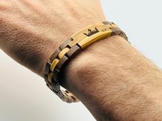 a man's arm with a wooden bracelet on it