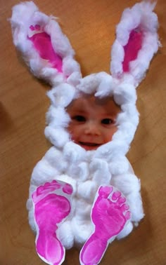 the baby is dressed up as a bunny