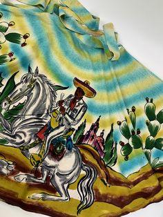 1950'S Hand Painted Mexican Skirt in a full circle with rich hand painted colors.. This skirt is longer than most at 33 inches! An artistic combination of Mexican themes with splashes of color in a boarder print. Beautiful, great colors and awesome details. The Mexican Senor on the horse is the front side of this skirt. This is made of 100% cotton. There is no maker or size label attached. I would say this is a WOMEN'S SIZE SMALL to MEDIUM.. with a 27 inch waist This waistband has hook & eye Mexican Skirt, Mexican Skirts, 27 Inch Waist, Full Circle Skirt, 1940s Dresses, Full Circle Skirts, Border Print, Back Women, Full Circle