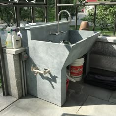 a concrete sink in the middle of a patio