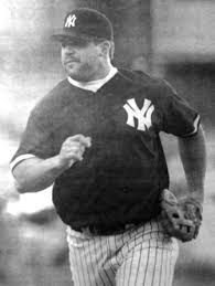 an old black and white photo of a baseball player